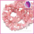 Bead, glass, pink ,cat's eye, small chip. Sold per 34-inch strand.
